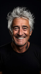 Obraz premium Mature handsome man with a spirited smile and trendy white hair against a dark backdrop