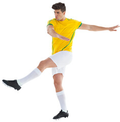 Digital png photo of biracial male footballer kicking on transparent background