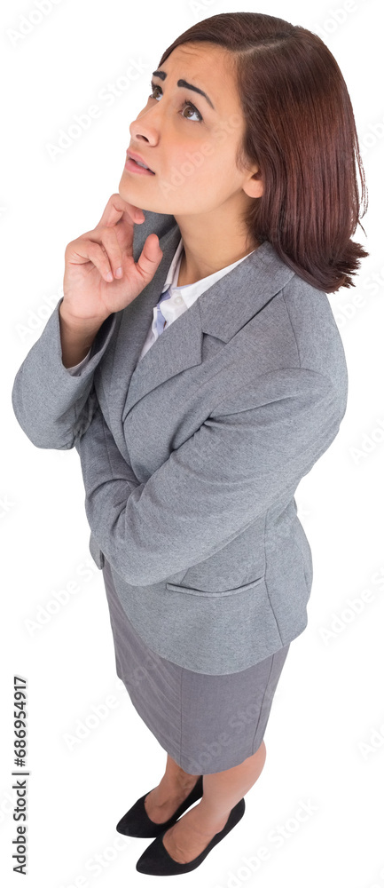 Wall mural Digital png photo of confused biracial businesswoman looking up on transparent background