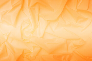 Yellow cloth with a wavy pattern, texture, background, wavy texture, soft, wrinkles from the cloth.