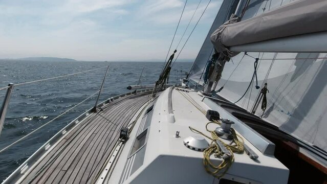 sea view from a sailing yacht during a regatta, view of the sea and waves, concept of lifestyle and freedom, slow motion
