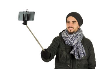 Digital png photo of happy caucasian man taking selfie using smartphone on transparent background