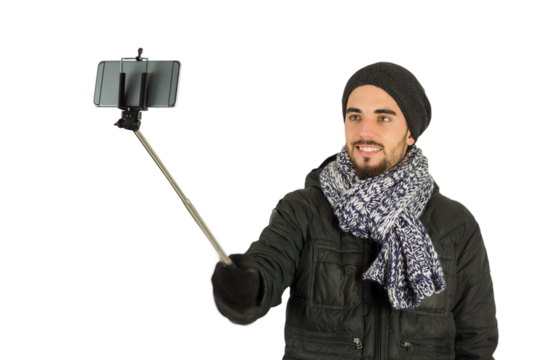 Digital png photo of happy caucasian man taking selfie using smartphone on transparent background