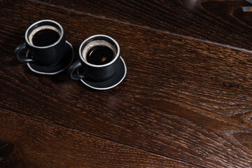 2 cups of coffee on wooden table