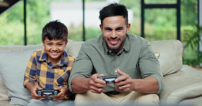 Dad, kid and play video game, smile and competition in home living room together. Tv tech, father and child on controller console, entertainment and happy family bonding in contest on sofa in lounge