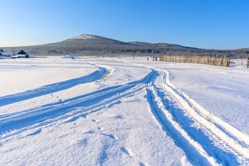 Fototapeta na wymiar Winter snowy village in the Ural mountains.