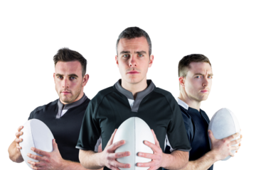 Digital png photo of three caucasian football players holding rugby balls on transparent background
