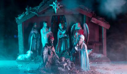 A Christmas nativity scene with baby Jesus, Mary and Joseph in the manger. Bethlehem. Christian...