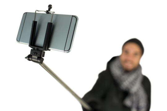 Digital png photo of biracial man taking selfie using smartphone on transparent background - Powered by Adobe