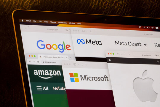Cupertino, CA, USA - Nov 28, 2023: Google, Amazon, Meta, Microsoft, and Apple logos are seen on their corporate websites on a MacBook Air laptop computer. Big tech concept.