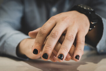Man with painted nails. Design of male nails. men manicure. The nails are painted in a fashionable...