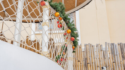 Buildings used for recreation Decorate the fence with white netting and Christmas pine. Light brown thatched walls Focus on nature See a bird's-eye view. Can be used as a background image.