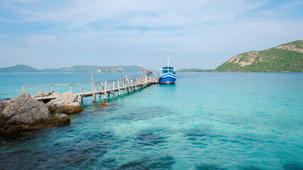 wooden pier jetty at Ko Kham Island Sattahip Chonburi Samaesan Thailand a tropical island with turqouse colored ocen