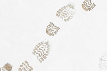 Human footprints in the snow close up. winter background