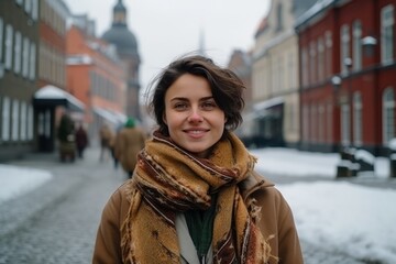Portrait of a beautiful young woman in the old town of Riga