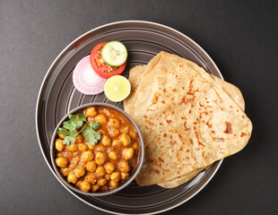 Indian vegetarian food - homemade fresh chapati served with vegetable stew and chickpeas curry 