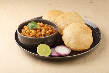 Indian food, spicy Chick Peas Curry also known as Chola/Chana Masala or Chole, served with fried puri or poori - obrazy, fototapety, plakaty