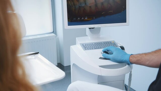 Dental treatment in professional hospital. Doctor practitioner using ultrasound 3D imaging technique on computer screen. Jaw diagnostic. Teeth correction.