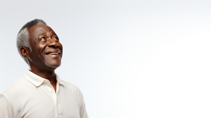 African american old man on white background looking up, copy space can be used for design