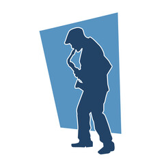 Silhouette of a musician playing saxophone music instrument. 