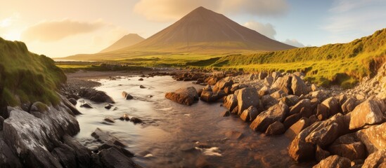 On Irelands spectacular West Coast, nestled in the heart of nature, lies Croagh Patrick, a majestic mountain adorned with lush vegetation and rugged rocks. Its towering peak beckons adventurers and - obrazy, fototapety, plakaty