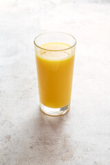 orange juice in a tall glass
