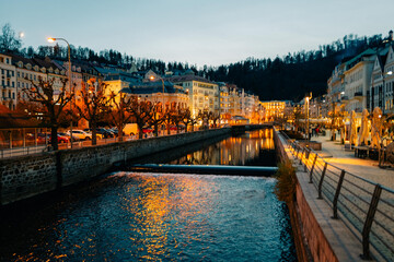 Panoramic view of Karlovy Vary in autumn, colored houses, evening