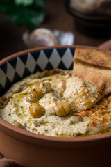 Close up hummus dip with pita
