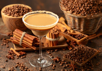 Chocolate martini cocktail or Irish cream liquor on a brown background.