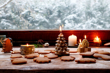 Festive Candles Burning by a Snow-Laden Window