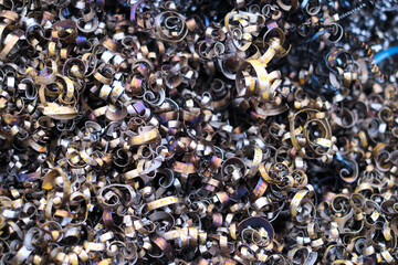 A close-up of intertwined metal scraps, highlighting the unintentional artistry found in...