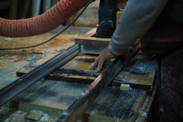 Woodworker shaping with tools. Demonstrates the demand for quality in a disposable world.