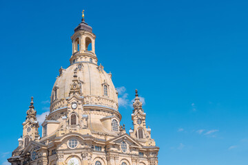 Fototapeta na wymiar Dresden, Germany. Church of our Lady at Neumarkt square in downtown of Dresden at sunny summer day with blue gradient sky and copy space