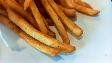 French fries or potato chips isolated on white background.