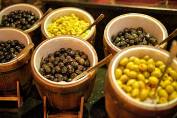 Olive selection at a local food market, close-up. Represents consumers' increased interest in Mediterranean diets.