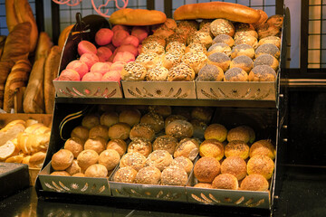 Freshly baked breads on display, a feast for the eyes. Taps into the trend of food photography and artisanal baking.