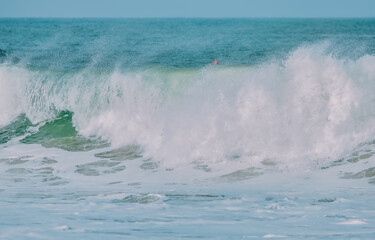 Wave splashing close-up. Crystal clear sea water, in the ocean in San Francisco Bay, blue water, pastel colors.