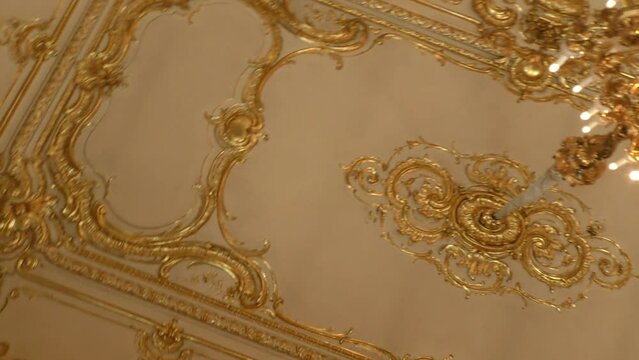 Interior of the palace is decorated with old mirrors and gilding. Vintage wall of the royal time.