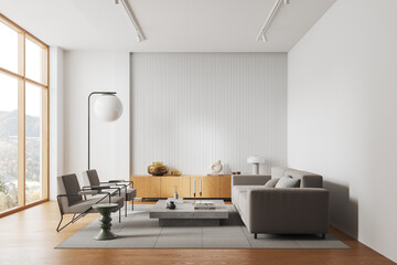 Stylish home living room interior with sofa and armchairs, panoramic window