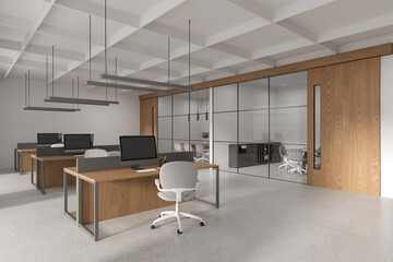 Stylish office interior with coworking and meeting room, pc monitors in row