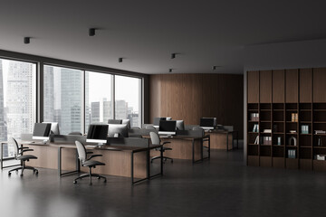 Gray and wooden open space office corner with bookcase