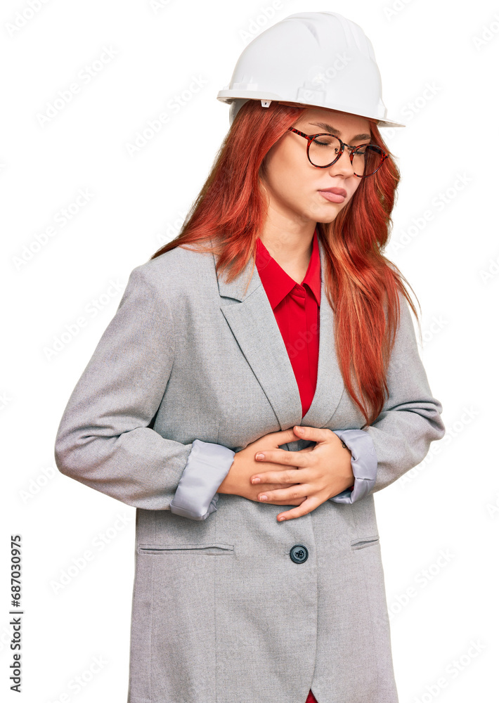 Canvas Prints young redhead woman wearing architect hardhat with hand on stomach because indigestion, painful illn