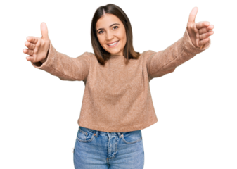 Young beautiful woman wearing casual clothes looking at the camera smiling with open arms for hug. cheerful expression embracing happiness.