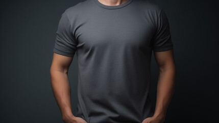 Man wearing grey t-shirt, isolated in dark background