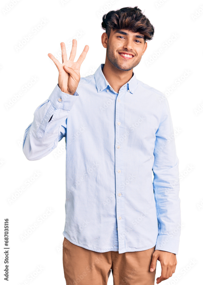 Wall mural young hispanic man wearing casual shirt showing and pointing up with fingers number four while smili