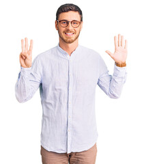 Naklejka premium Handsome young man with bear wearing elegant business shirt and glasses showing and pointing up with fingers number eight while smiling confident and happy.