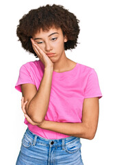 Young hispanic girl wearing casual clothes thinking looking tired and bored with depression problems with crossed arms.