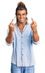 Young hispanic man wearing summer style showing middle finger doing fuck you bad expression,...