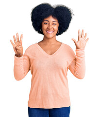 Young african american girl wearing casual clothes showing and pointing up with fingers number nine while smiling confident and happy.