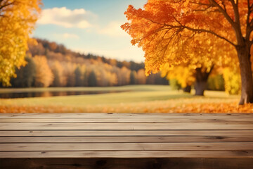 Naklejka na ściany i meble Empty wooden table with autumn leaves background 